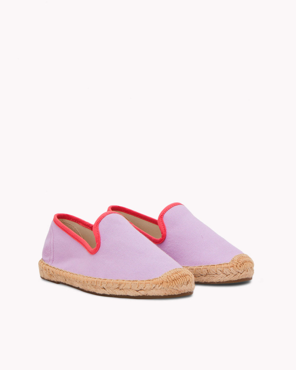 Kids lavender espadrille shoes with red piping on gray background