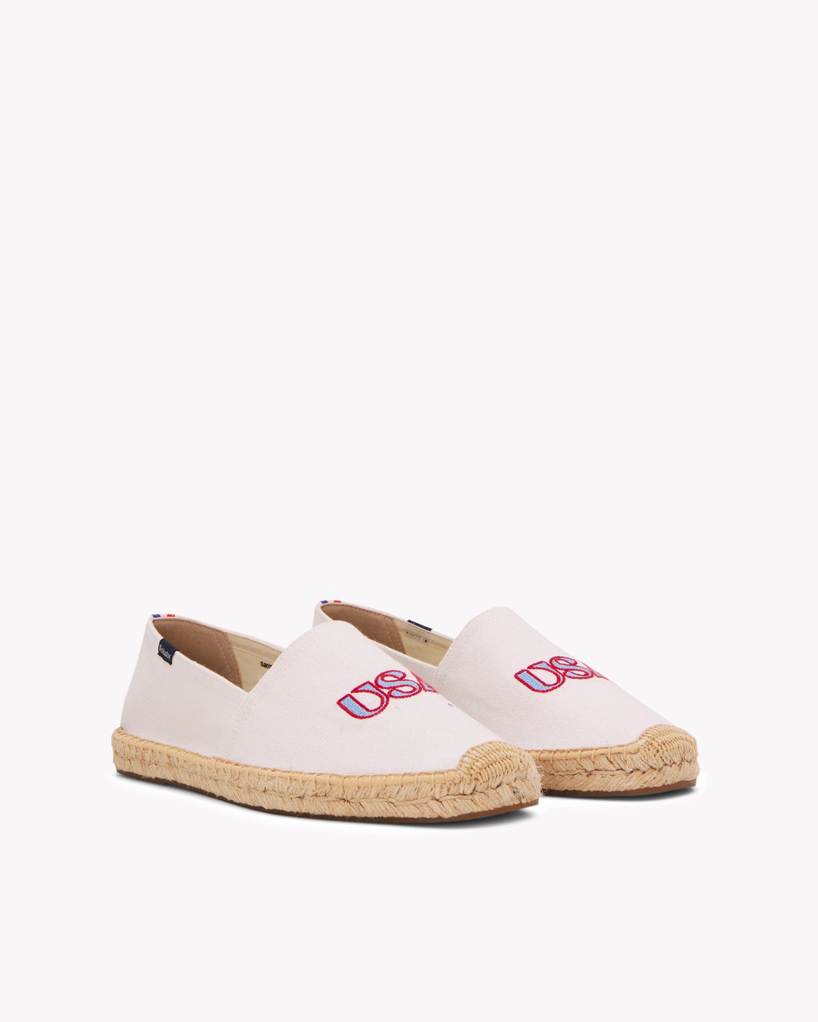 Angled front view of men's USA embroidery espadrille in white with blue and red embroidery