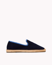 Men's navy espadrille shoes with blue piping on gray background
