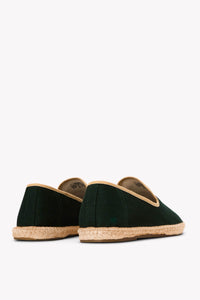 Men's oak green espadrille shoes with tan piping on gray background