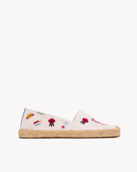 Side view of women's USA embroidery espadrille in white with colorful embroidery