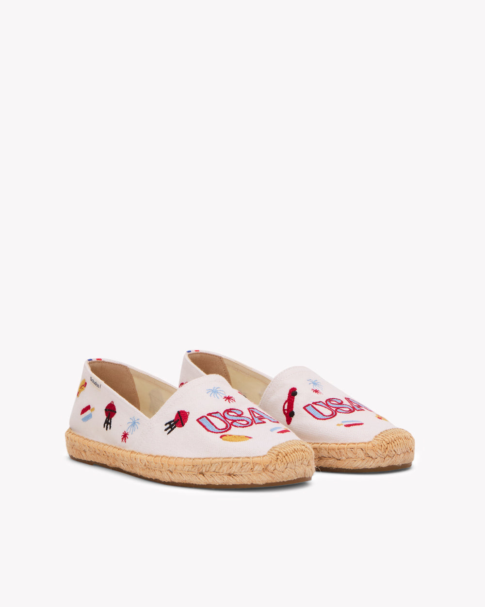 Angled front view of women's USA embroidery espadrille in white with colorful embroidery