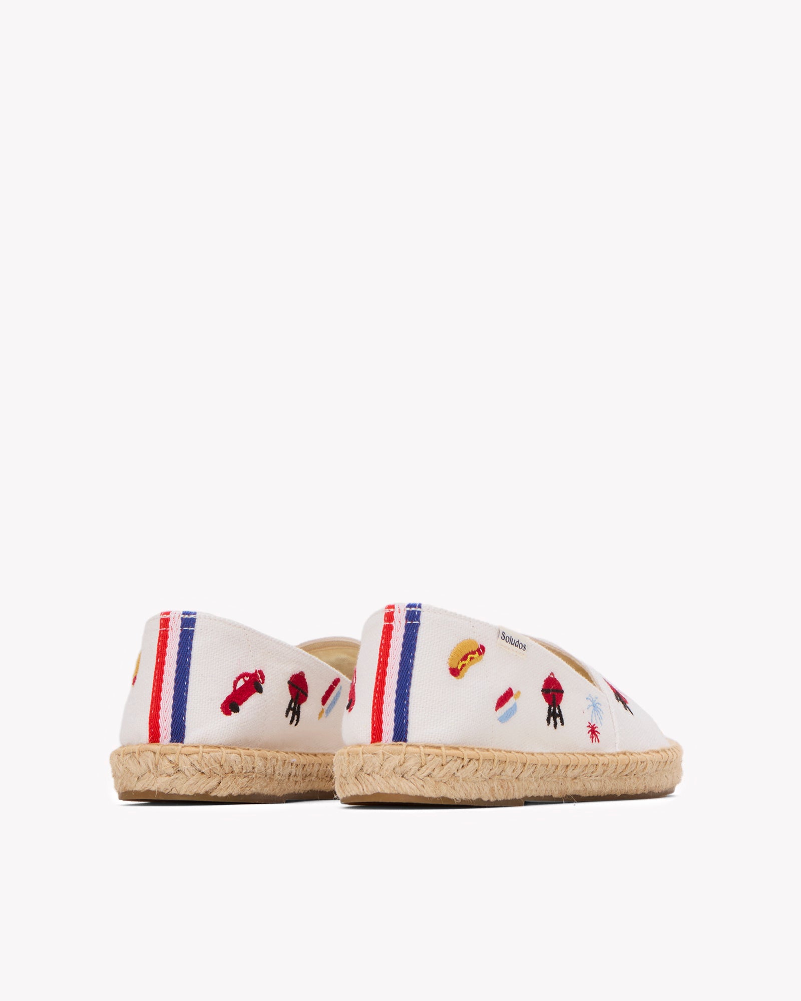 Angled back view of women's USA embroidery espadrille in white with colorful embroidery