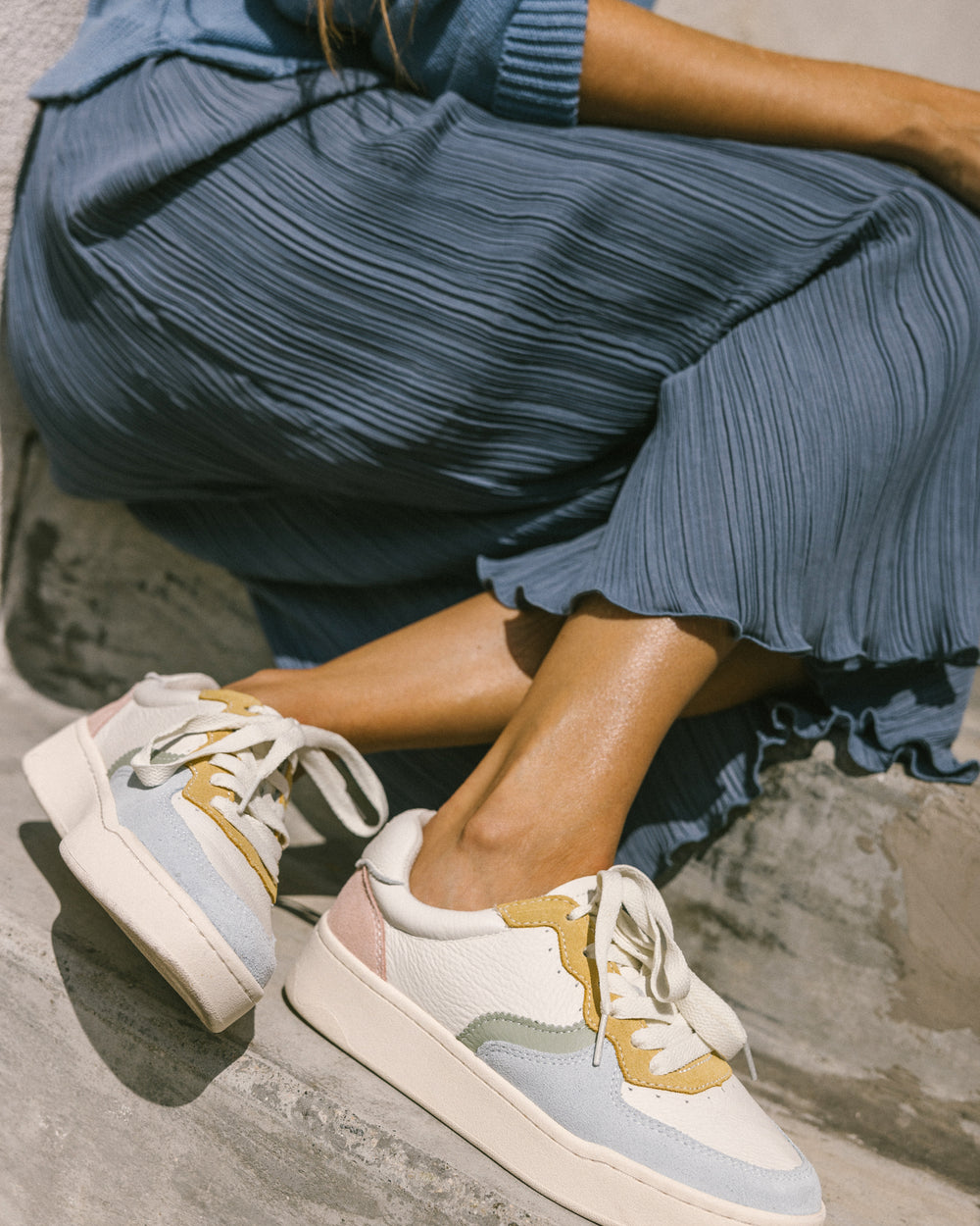 woman wearing pastel sneakers