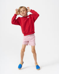 Blond boy wearing blue espadrilles with yellow piping