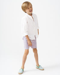 Blond boy wearing mint espadrilles with green piping